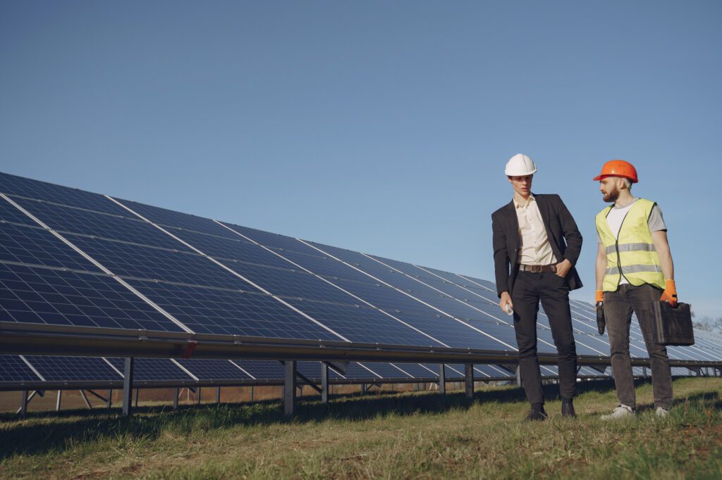 Foreman and businessman at solar energy station