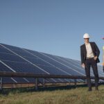 Foreman and businessman at solar energy station